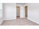 Neutral walls, carpet, closet, and access to other rooms are features of this bedroom at 126 Hancher Dr., Myrtle Beach, SC 29588