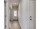 Hallway with hardwood flooring and access to various rooms with neutral colored walls at 126 Hancher Dr., Myrtle Beach, SC 29588