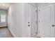 Hallway with wood flooring and access to rooms with white doors at 126 Hancher Dr., Myrtle Beach, SC 29588