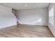 Bright living room with wood floors, large windows, and stairway at 126 Hancher Dr., Myrtle Beach, SC 29588