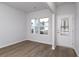 Well lit living room with wood floors, white walls, and a view of the yard at 126 Hancher Dr., Myrtle Beach, SC 29588