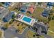 Aerial view of the community pool and lounge area, surrounded by lush landscaping and vibrant community amenities at 1533 Biltmore Dr., Myrtle Beach, SC 29579