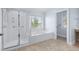 Bathroom showcases a separate shower, large soaking tub, and natural light at 1533 Biltmore Dr., Myrtle Beach, SC 29579