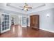 Bright bedroom with hardwood floors, an armoire, neutral paint, and access to a private bathroom at 1533 Biltmore Dr., Myrtle Beach, SC 29579