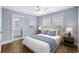 Well-lit bedroom boasts hardwood floors, neutral paint, ceiling fan, and a spacious closet at 1533 Biltmore Dr., Myrtle Beach, SC 29579