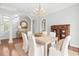 Stylish dining room with a chandelier, seating for six, and warm wood flooring at 1533 Biltmore Dr., Myrtle Beach, SC 29579