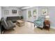 Cozy living room features access to backyard, tile floors, neutral paint, recessed lights, and ample seating at 1533 Biltmore Dr., Myrtle Beach, SC 29579