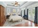 Comfortable main bedroom with trey ceilings, ceiling fan, and direct access to a private outdoor balcony at 1533 Biltmore Dr., Myrtle Beach, SC 29579