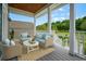 Relaxing front porch with wicker furniture and a stylish rug, perfect for enjoying the outdoors at 1533 Biltmore Dr., Myrtle Beach, SC 29579