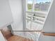 An open staircase showcases a statement chandelier and multi-pane windows offering an abundance of natural light at 1533 Biltmore Dr., Myrtle Beach, SC 29579