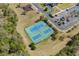 Aerial view of tennis courts with lush surroundings, offering a vibrant recreational space for residents and guests at 1533 Biltmore Dr., Myrtle Beach, SC 29579