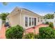 Landscaped backyard with patio and French doors at 4333 Windy Heights Dr., North Myrtle Beach, SC 29582