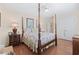 Elegant bedroom with hardwood floors and a four poster bed at 4333 Windy Heights Dr., North Myrtle Beach, SC 29582