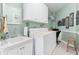 Bright laundry room with washer, dryer, and utility sink at 4333 Windy Heights Dr., North Myrtle Beach, SC 29582