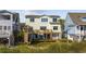 Back exterior view with decks and a view of the water; this home is made for entertaining at 4524 Landing Rd., Little River, SC 29566