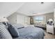 Spacious bedroom featuring two beds, ceiling fan, closet, and windows with views of the water at 4524 Landing Rd., Little River, SC 29566