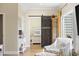 Bedroom features a sliding barn door leading to the sleeping area and a decorative grandfather clock at 4524 Landing Rd., Little River, SC 29566
