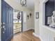 Inviting entryway with wood floors, a view of the outdoor deck, and stylish decorations at 4524 Landing Rd., Little River, SC 29566