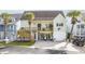 Coastal home featuring a charming two-story design with a wooden deck, ground floor lounge area, and a garage at 4524 Landing Rd., Little River, SC 29566