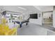 Spacious garage area featuring a pool table, TV, and access to the outside, perfect for entertainment and relaxation at 4524 Landing Rd., Little River, SC 29566