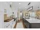 Modern kitchen featuring a spacious island, stainless steel appliances, and bright white cabinetry at 4524 Landing Rd., Little River, SC 29566