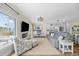 Bright living room with an open concept to a modern kitchen, comfortable seating, and natural light at 4524 Landing Rd., Little River, SC 29566