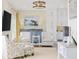 Living room featuring stylish seating, decor, and access to the adjacent dining and kitchen areas at 4524 Landing Rd., Little River, SC 29566