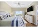 Bright main bedroom featuring a ceiling fan, and a large window with picturesque views at 4524 Landing Rd., Little River, SC 29566