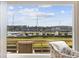 Stunning marina view from the living room window, showcasing boats and tranquil waters at 4524 Landing Rd., Little River, SC 29566