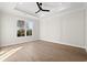 Bedroom featuring wood floors, a tray ceiling, and recessed lighting at 110 Brian Oaks Trail, Conway, SC 29527