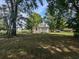 Back view of a white house with grassy yard at 114 Henry Mcgill St., Marion, SC 29571