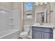 Bright bathroom features a tub-shower combo, toilet, and vanity with neutral countertops at 626 Castle Ct., Myrtle Beach, SC 29579