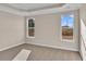 Bright bedroom featuring neutral walls, plush carpeting, and tray ceiling for a comfortable living space at 626 Castle Ct., Myrtle Beach, SC 29579