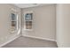 Bedroom featuring two windows that provides natural light and a neutral carpet that enhances comfort at 626 Castle Ct., Myrtle Beach, SC 29579