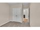 Bedroom featuring carpet, neutral walls, closet, and doorway to the bathroom and other rooms at 626 Castle Ct., Myrtle Beach, SC 29579