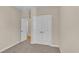 Bedroom featuring closet, neutral walls, carpet flooring, and doorway leading to other rooms at 626 Castle Ct., Myrtle Beach, SC 29579