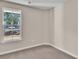 Cozy bedroom showcasing neutral color palette, carpet flooring, and natural light from the window at 626 Castle Ct., Myrtle Beach, SC 29579