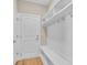 Functional mudroom with coat hooks, cubbies, seating, and neutral paint color at 626 Castle Ct., Myrtle Beach, SC 29579