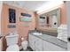 Bright bathroom with a modern vanity, decorative accents, and beach-themed decor for a relaxing vacation feel at 7000 Ocean Blvd. N # 133, Myrtle Beach, SC 29572