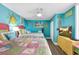 Cozy bedroom featuring two beds, colorful accents, beach decor, and plenty of natural light from the windows at 7000 Ocean Blvd. N # 133, Myrtle Beach, SC 29572