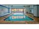 Inviting indoor pool with ample natural light and blue accents, providing year-round recreational enjoyment at 7000 Ocean Blvd. N # 133, Myrtle Beach, SC 29572