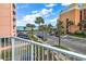 Picturesque view of the ocean and palm trees from the balcony, showcasing the beautiful coastal surroundings at 7000 Ocean Blvd. N # 133, Myrtle Beach, SC 29572