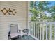 Relaxing balcony with a chair and table, offering wooded views at 500 River Oaks Dr. # 58I, Myrtle Beach, SC 29579