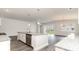 Open kitchen with stainless steel appliances and island, connected to living and dining areas at 368 Clear Lake Dr., Conway, SC 29526