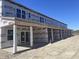 Modern townhome exterior features covered entryways and ample natural light, ready for customization at 6876 Watertower Rd. # 202, Longs, SC 29568
