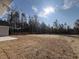 New construction backyard featuring sod with partial view of woods at 1033 Sioux Swamp Dr., Conway, SC 29527