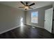 Bedroom featuring a ceiling fan, window letting in natural light, and luxury vinyl plank flooring at 1033 Sioux Swamp Dr., Conway, SC 29527