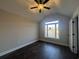 Bedroom featuring dark wood floors, neutral paint and a large window at 1033 Sioux Swamp Dr., Conway, SC 29527