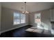 Dining room featuring dark wood floors, neutral paint and a modern chandelier at 1033 Sioux Swamp Dr., Conway, SC 29527