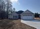 Charming single-story home with a two-car garage and a well-manicured front yard at 1033 Sioux Swamp Dr., Conway, SC 29527